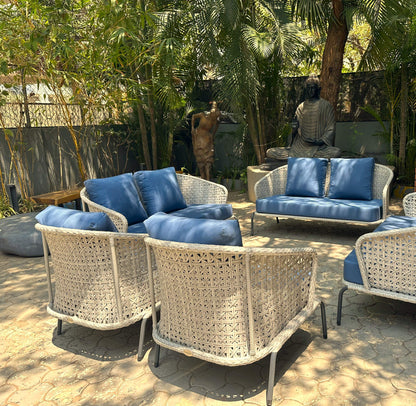 Blue fabric outdoor sofa set with modern design and wicker accents