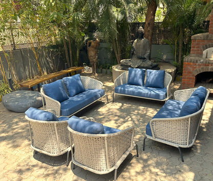 Blue fabric outdoor sofa set with modern design and wicker accents